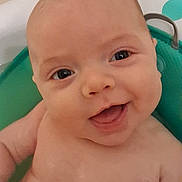 Atlas joined the competition — help win amazing prizes! baby, smiling, face, closeup, infant, happy, child, skin, blue_eyes, bath, water, green, seat, cute, portrait, expression, young, person, indoor, cheerful