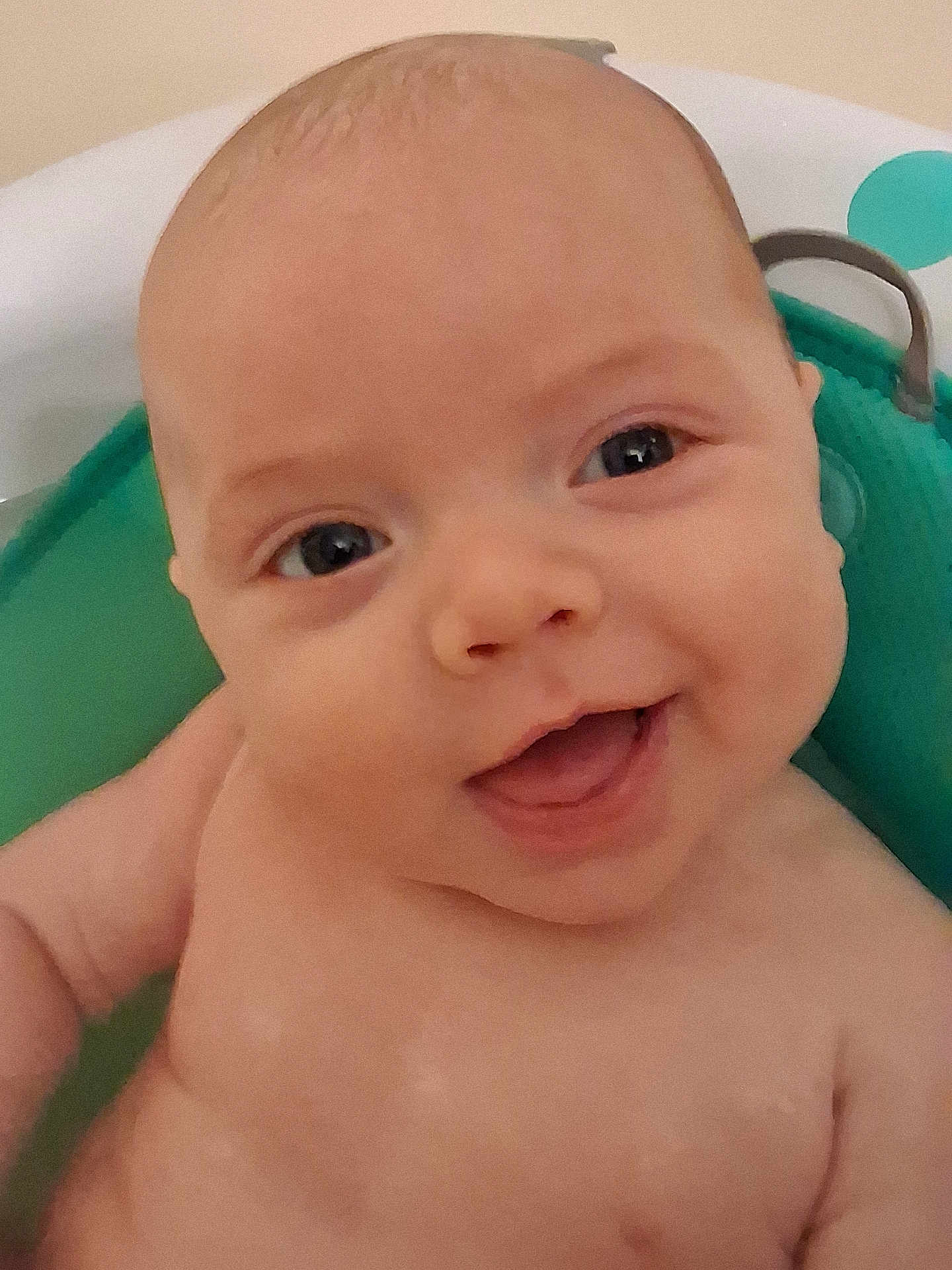 Atlas joined the competition — help win amazing prizes! baby, smiling, face, closeup, infant, happy, child, skin, blue_eyes, bath, water, green, seat, cute, portrait, expression, young, person, indoor, cheerful