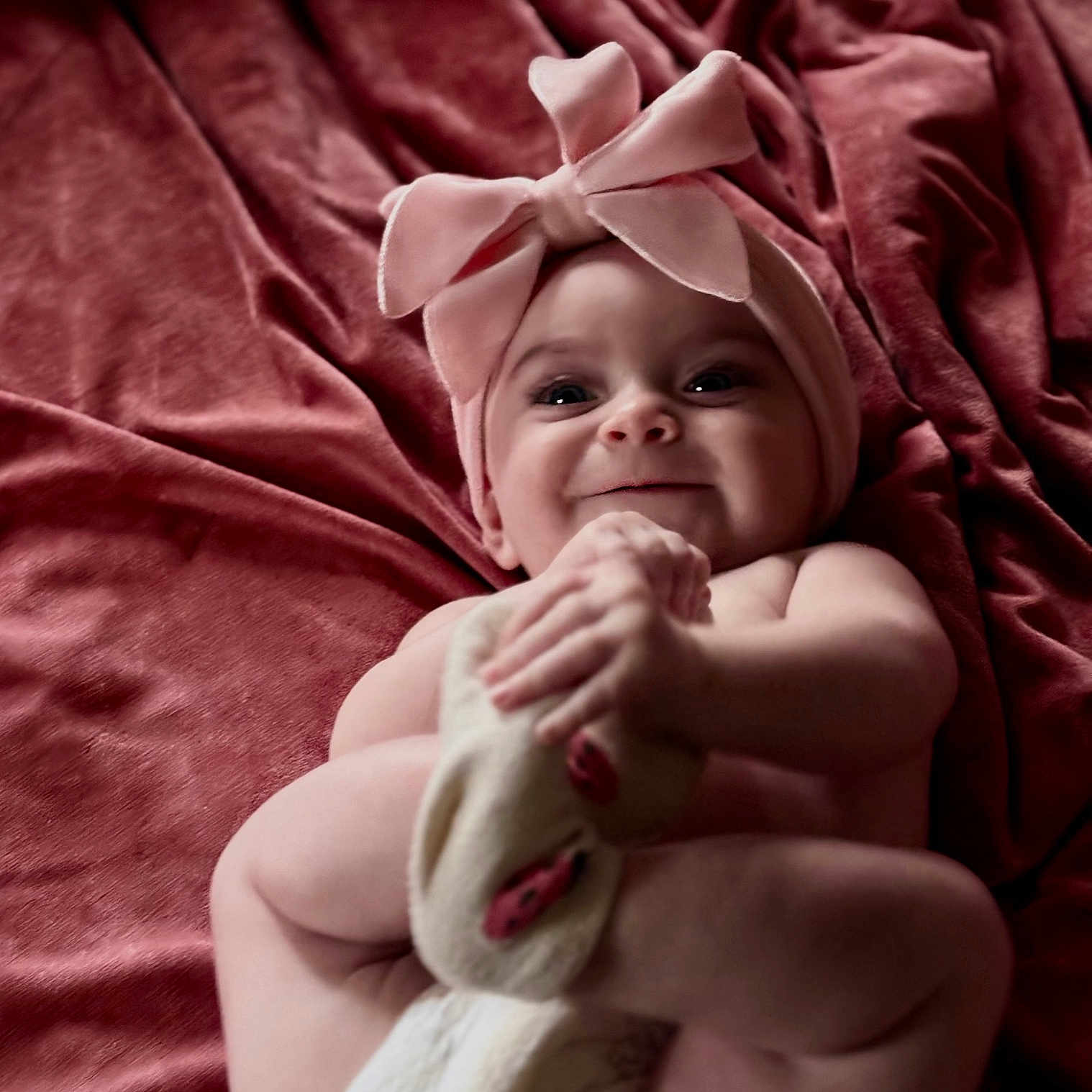 Kodi joined the competition — help win amazing prizes! baby, blanket, bow, child, close_up, cute, expression, foot, hand, happy, headband, indoors, infant, lying_down, playful, portrait, skin, smile, soft_texture, toddler