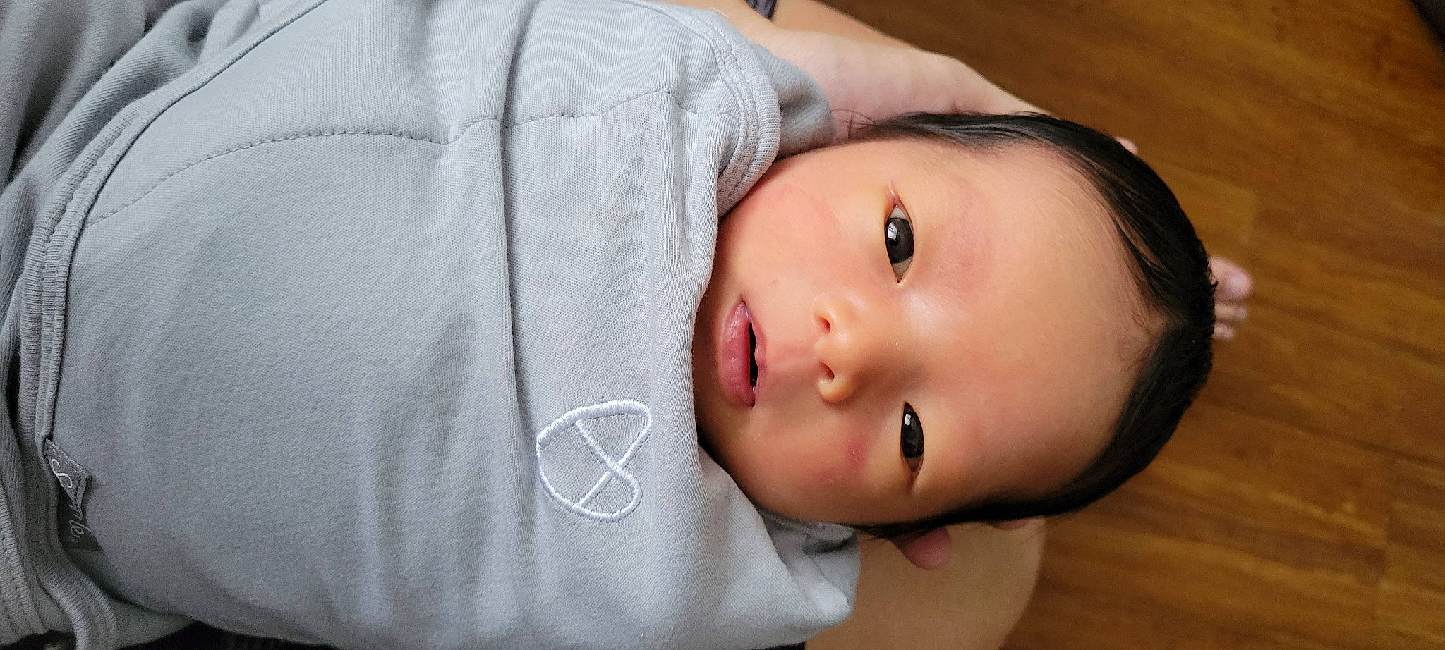 Zoey is registered to the contest to win money with this photo: baby, cheek, child, chin, comfort, eyelash, flash_photography, happy, iris, lip, no_expression, nose, person, portrait, portrait_photography, skin, sleeve, throat, toddler, wood