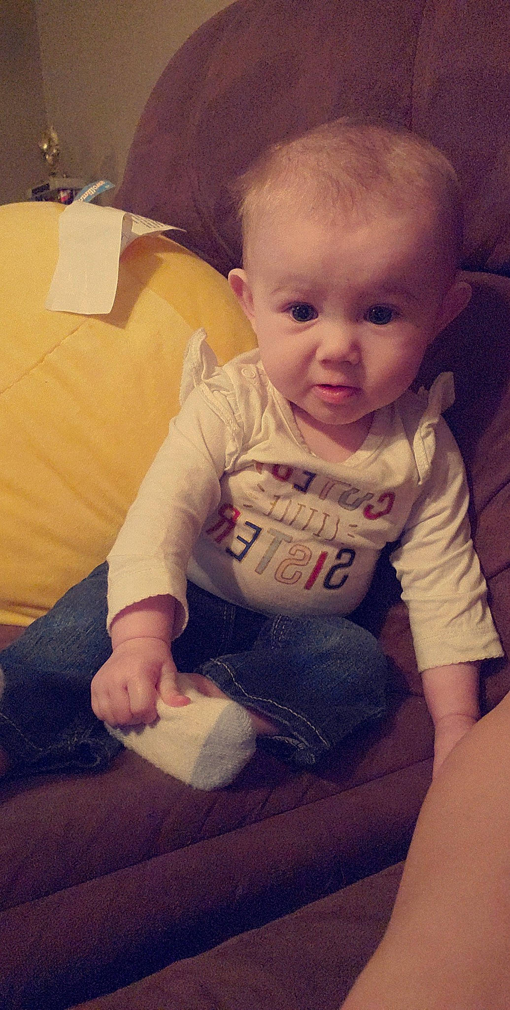 Emori is registered to the contest to win money with this photo: arm, baby, cheek, child, chin, eye, face, head, leg, lip, mouth, person, sitting, skin, smile, toddler