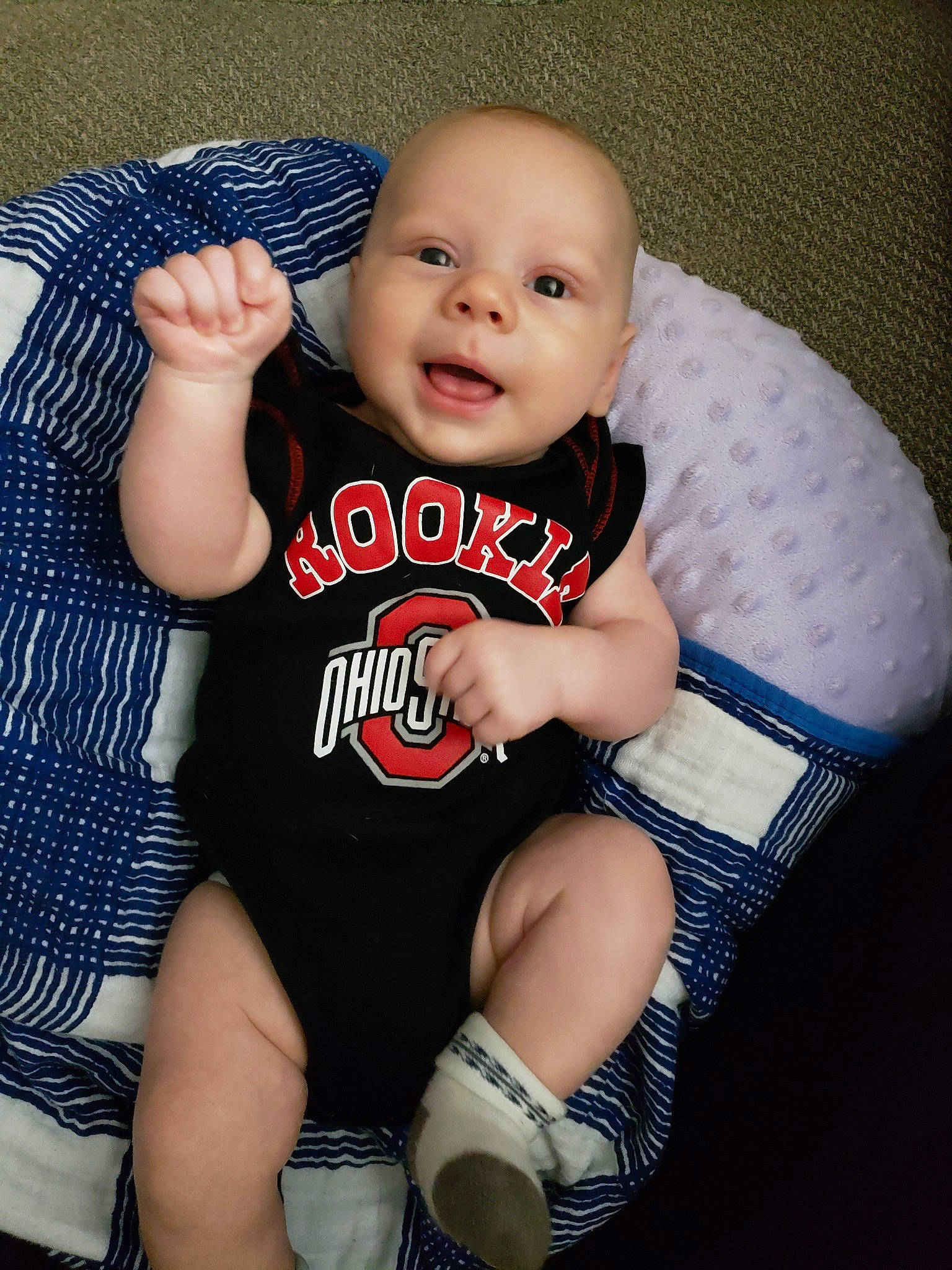 Benjamin is registered to the contest to win money with this photo: baby, baby_products, baby_toddler_clothing, cheek, child, finger, leg, person, product, shoe, sitting, skin, sleeve, t_shirt, toddler