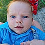 Keith is registered to the contest to win money with this photo: baby, blue_eyes, red_hair, blue_shirt, outdoor, grass, infant, child, hand, face, curious_expression, polka_dot, sunlight, skin, person, young_child, clothing, cute, portrait, holding