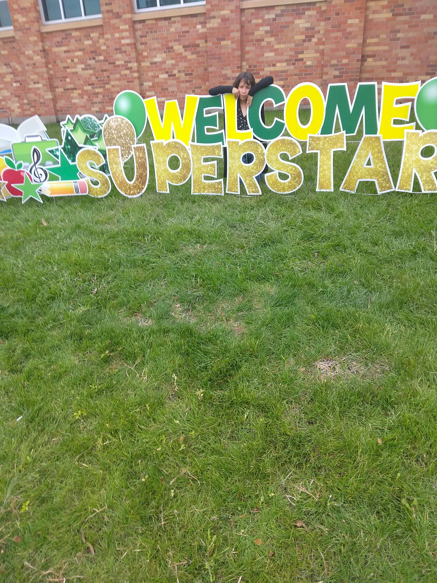 Evelyn joined the competition — help win amazing prizes! art, brick, brickwork, building, city, flooring, font, grass, grass_family, groundcover, land_lot, landscape, lawn, leisure, natural_landscape, person, plant, signage, tree, urban_design