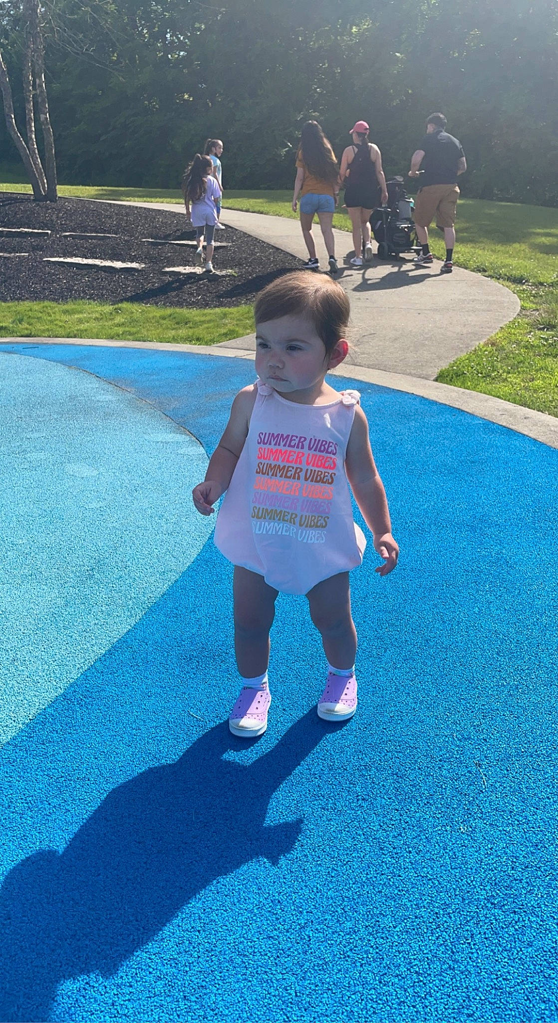 Ashtyn joined the competition — help win amazing prizes! aqua, asphalt, azure, blue, electric_blue, footwear, fun, grass, lawn, leg, leisure, light, nature, person, plant, public_space, recreation, road_surface, shorts, toddler