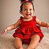 baby, child, smiling, red_dress, hair_bows, toddler, cute, happy, portrait, indoors, fluffy_rug, sitting, skin, face, arms, legs, toes, studio, adorable, fashion