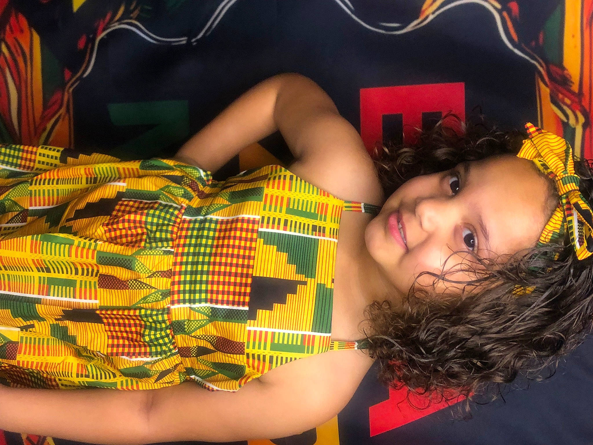 Tamtaniyah is registered to the contest to win money with this photo: black_hair, blond, fashion, flash_photography, fun, grass, happy, human_body, human_leg, joy, lighting, long_hair, mouth, orange, pattern, person, plaid, smile, tartan, thigh