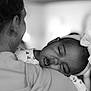 Malika a rejoint le concours — aidez-le/la à gagner de superbes lots ! baby, sleeping, black_and_white, headband, adult, shoulder, close_up, portrait, peaceful, child, comfort, love, toddler, face, person, calm, resting, monochrome, candid, intimate
