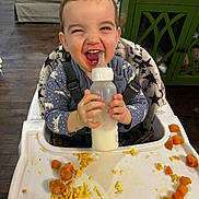 Jackson joined the competition — help win amazing prizes! beverage, bottle, cream, cutlery, dessert, diningtable, eating, face, food, furniture, happy, head, icecream, milk, person, photography, portrait, shaker, spoon, table