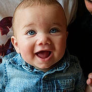 Teodor is registered to the contest to win money with this photo: baby, baby_smile, blue_eyes, casual_wear, child, closeup, clothing, cute, denim_shirt, face, family, happy, holding_hands, indoor, infant, person, portrait, short_hair, skin, smiling