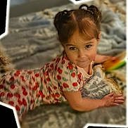 Destiny joined the competition — help win amazing prizes! child, girl, pigtails, blanket, patterned_clothing, cherry_pattern, smile, face, hand, indoor, cozy, candid, portrait, cute, young, playful, childhood, person, toddler, relaxing