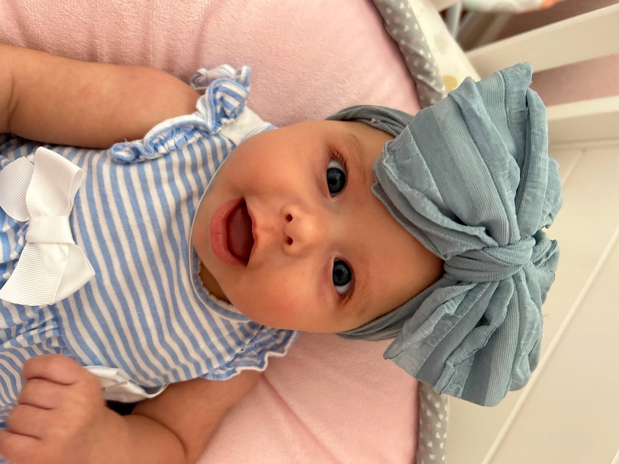 Gabriella is registered to the contest to win money with this photo: baby, baby_toddler_clothing, cheek, child, comfort, eyelash, grass, happy, hat, headwear, iris, lip, mouth, neck, nose, pattern, person, plant, skin, textile