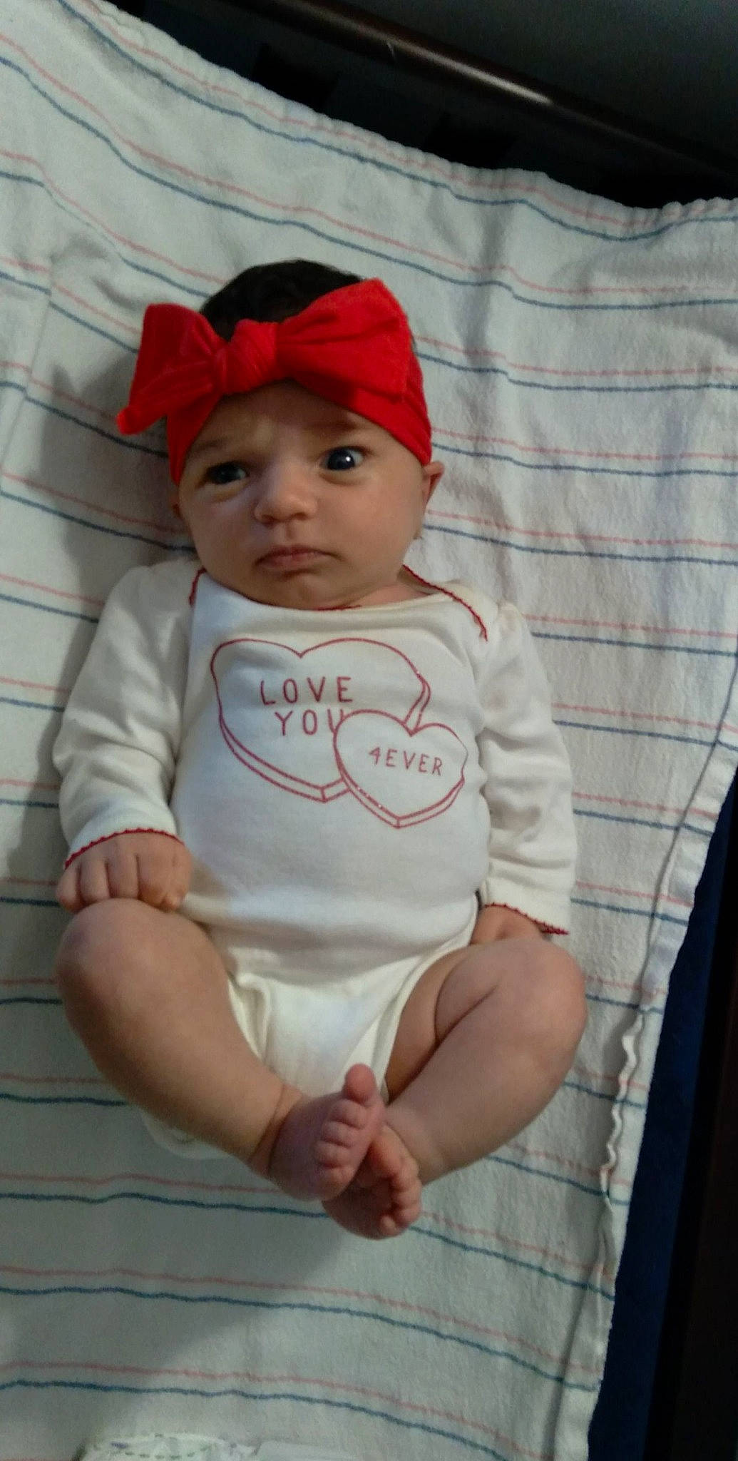 Kaisley is registered to the contest to win money with this photo: baby, baby_products, baby_toddler_clothing, cap, carmine, chair, cheek, child, comfort, face, fashion_accessory, hat, headwear, linens, lip, pattern, person, sitting, skin, sleeve