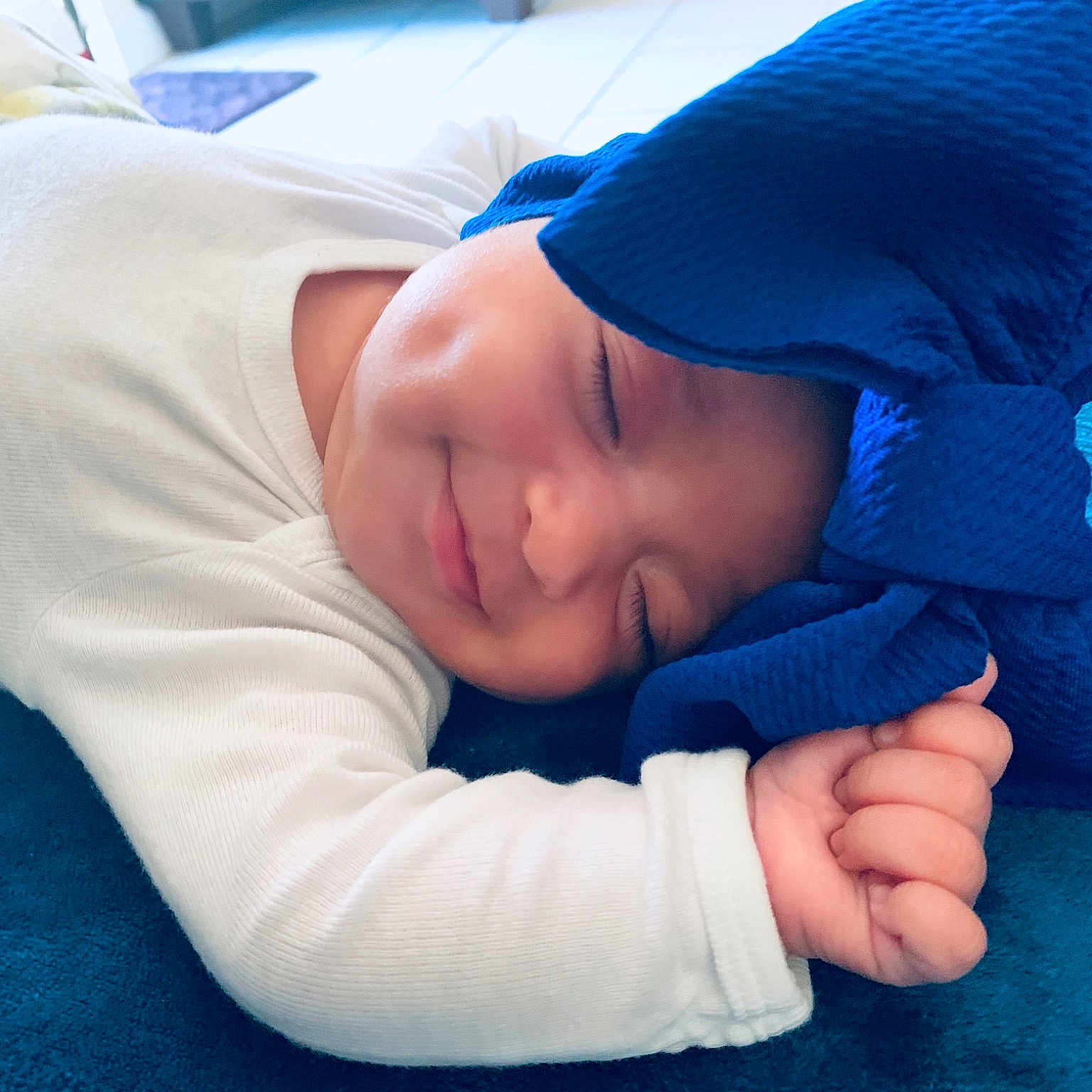 Alex is registered to the contest to win money with this photo: arm, baby, blue, cheek, child, finger, gesture, hand, headgear, mouth, nap, nose, skin, sleep, smile, toddler