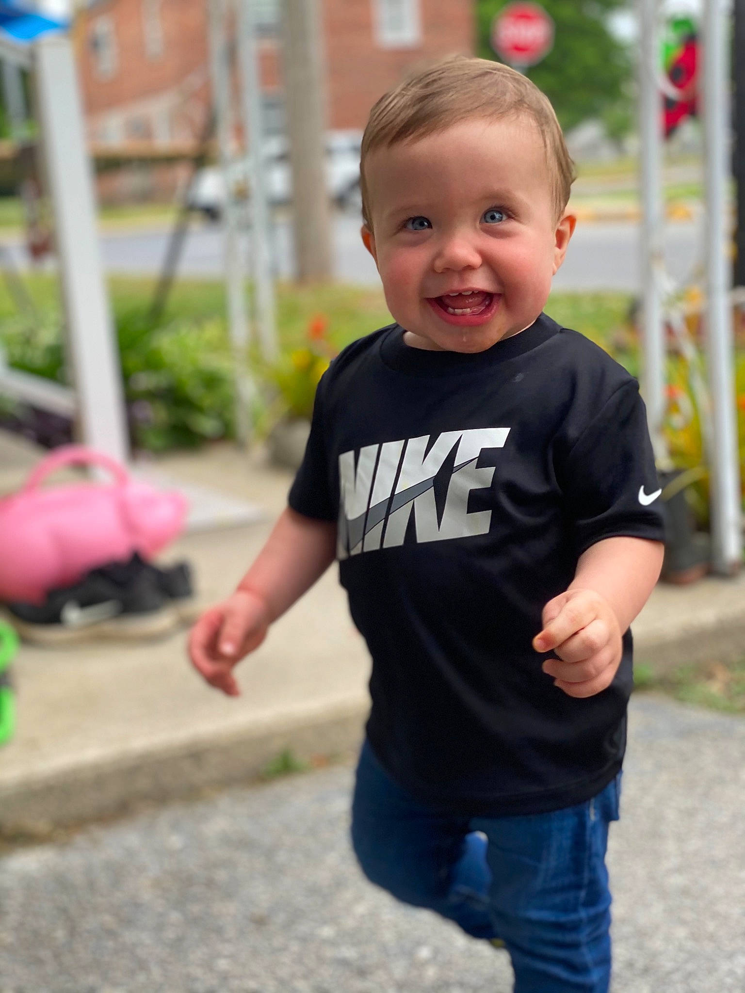 Wesley is registered to the contest to win money with this photo: baby, child, city, denim, electric_blue, face, fun, grass, happy, joy, leisure, person, plant, play, recreation, sitting, sleeve, smile, street_fashion, t_shirt