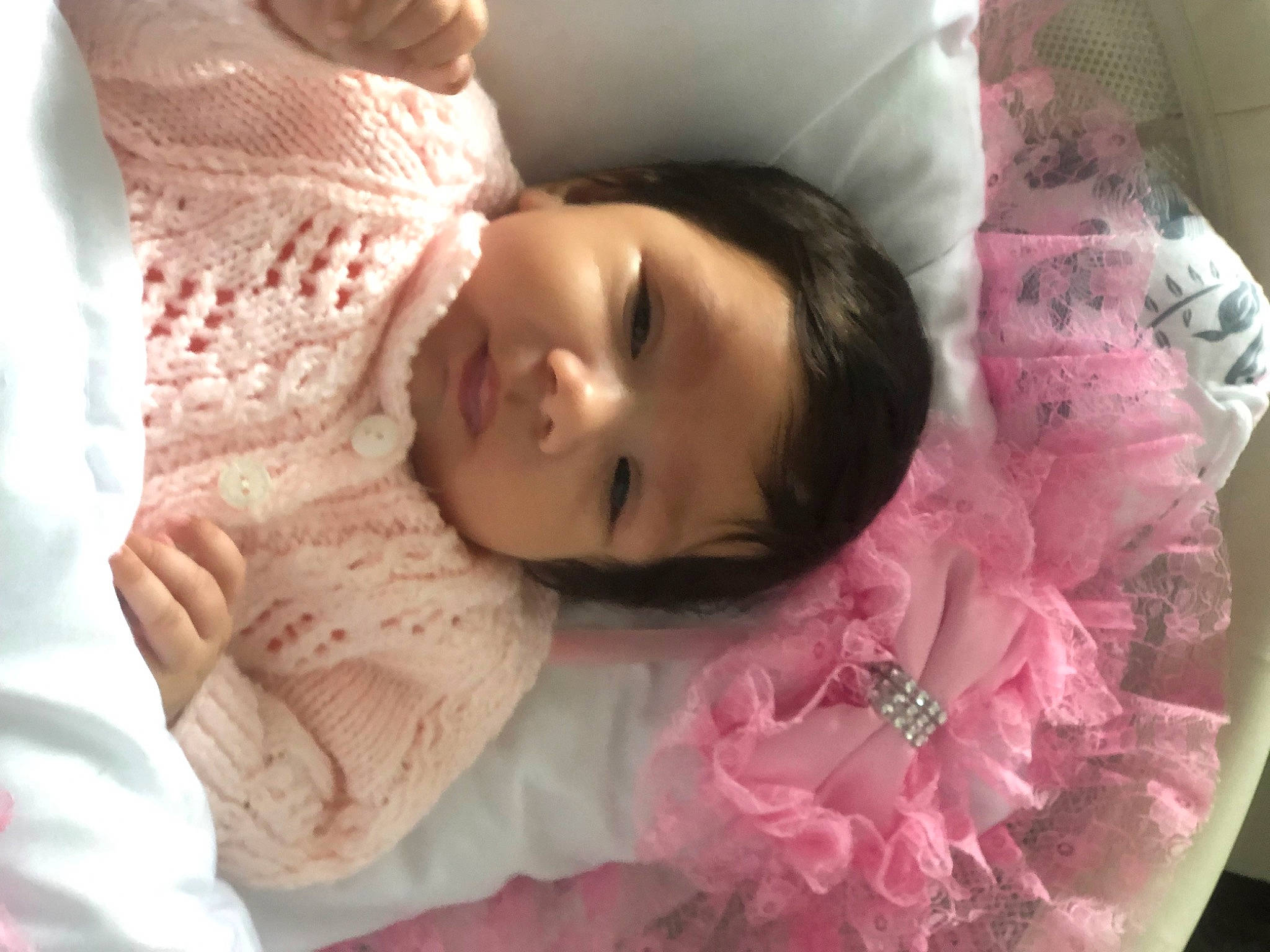 Maria is registered to the contest to win money with this photo: baby, beauty, cheek, child, comfort, ear, eyebrow, eyelash, happy, headgear, linens, lip, mouth, nose, person, pink, skin, sleeve, smile, textile