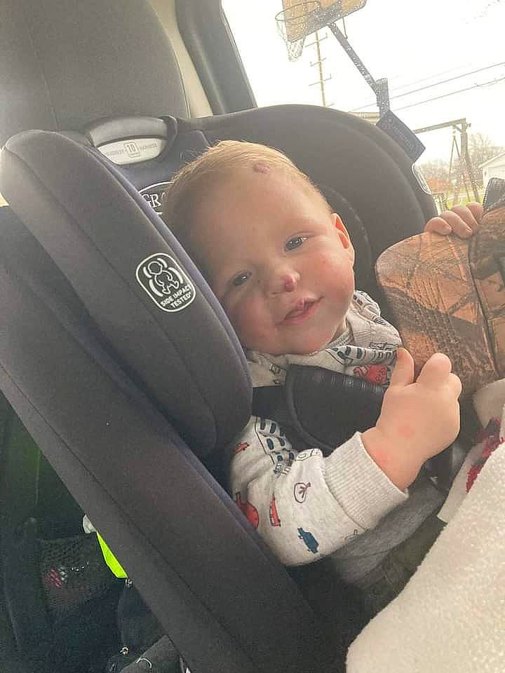 Grayson is registered to the contest to win money with this photo: auto_part, automotive_design, automotive_exterior, automotive_tire, automotive_wheel_system, baby, baby_carriage, car, car_seat, car_seat_cover, child, comfort, motor_vehicle, person, plant, product, seat_belt, steering_wheel, toddler, vehicle_door
