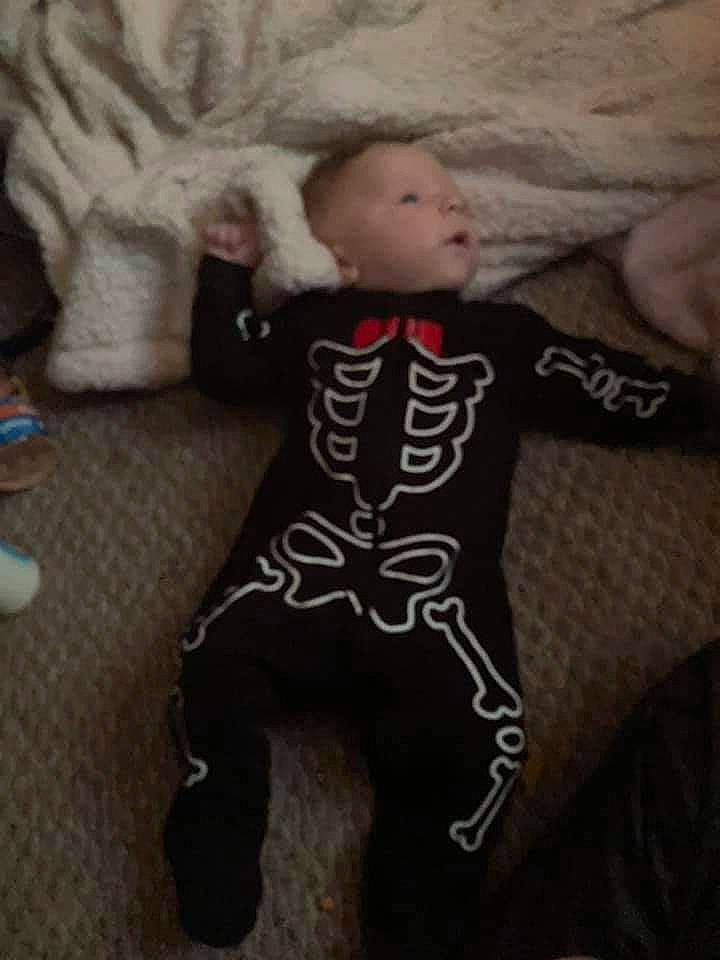 Grayson is registered to the contest to win money with this photo: baby, baby_products, baby_toddler_clothing, child, comfort, doll, flooring, fun, fur, head, human_body, linens, person, sleeve, sportswear, stuffed_toy, t_shirt, tail, textile, toddler