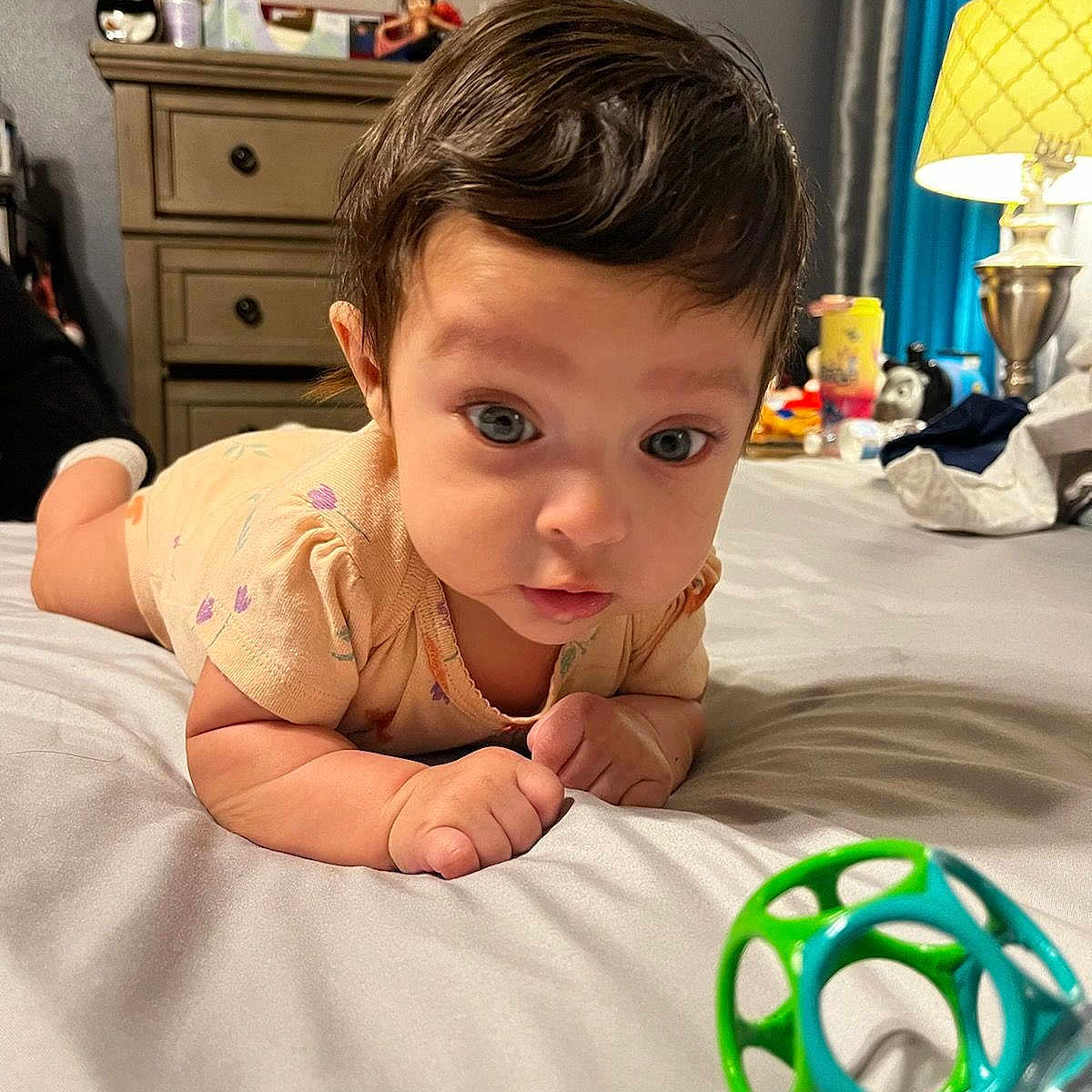 Krystal is registered to the contest to win money with this photo: baby, babycrawling, bed, bedroom, bottle, crawling, face, furniture, hair, happy, head, indoors, lamp, person, photography, portrait, room, shaker, tablelamp, toy