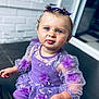 toddler, child, blue_eyes, purple_dress, floral_embroidery, tulle, curly_hair, hair_bows, portrait, cute, indoors, person, baby, dress, sitting, face, expression, hands, skin, young_child