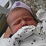 Dean joined the competition — help win amazing prizes! newborn, baby, infant, sleeping, onesie, hat, hospital, bed, blanket, soft, face, person, clothing, cute, newborn_baby, closeup, indoors, resting, human, child