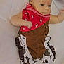 Dean is registered to the contest to win money with this photo: baby, baby_clothes, bandana, black, brown, child, clothing, cowboy_outfit, cute, expression, face, infant, looking, lying_down, person, portrait, red, small, soft_surface, white