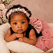 Davina is registered to the contest to win money with this photo: baby, infant, child, basket, headband, pearl, flowers, pink_dress, roses, soft_fabric, curly_hair, portrait, closeup, cute, adorable, indoor, decor, skin, hands, face