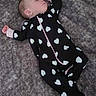 Sky joined the competition — help win amazing prizes! baby, sleeping, onesie, hearts, black_clothing, white_pattern, infant, soft_surface, gray_background, peaceful, cute, child, portrait, lying_down, cozy, comfort, sleep, young_child, person, indoors