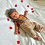 Isaac participe au concours pour gagner de l'argent avec cette photo : baby, infant, child, cute, heart, red_heart, blanket, soft, clothing, cap, pants, suspenders, lying_down, portrait, indoors, skin, small_hands, small_feet, adorable, looking_at_camera