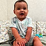 Oatlyn joined the competition — help win amazing prizes! baby, background, bed, child, cute, face, floral, foot, hand, happy, indoors, person, pillow, shorts, sitting, skin, smiling, toy, tshirt, young