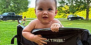 Oatlyn joined the competition — help win amazing prizes! baby, camping_chair, car, chair, child, face, grass, greenery, hands, happy, nature, outdoor, park, people, pickup_truck, playing, smiling, summer, sunlight, tree
