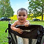 Oatlyn joined the competition — help win amazing prizes! baby, child, outdoor, grass, tree, chair, camping_chair, smiling, greenery, car, pickup_truck, sunlight, hands, face, happy, summer, playing, nature, park, people