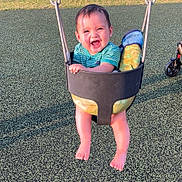 Oatlyn joined the competition — help win amazing prizes! baby, swing, playground, child, smiling, happy, outdoor, sunlight, grass, park, feet, infant, joyful, toy, seat, green, summer, fun, play, toddler