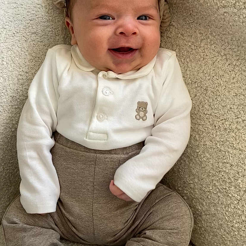 Bodhi joined the competition — help win amazing prizes! baby, babylaughing, clothing, crying, face, footwear, happy, head, jeans, laughing, newborn, pants, person, photography, portrait, sad, shoe, sitting, smile, sneaker