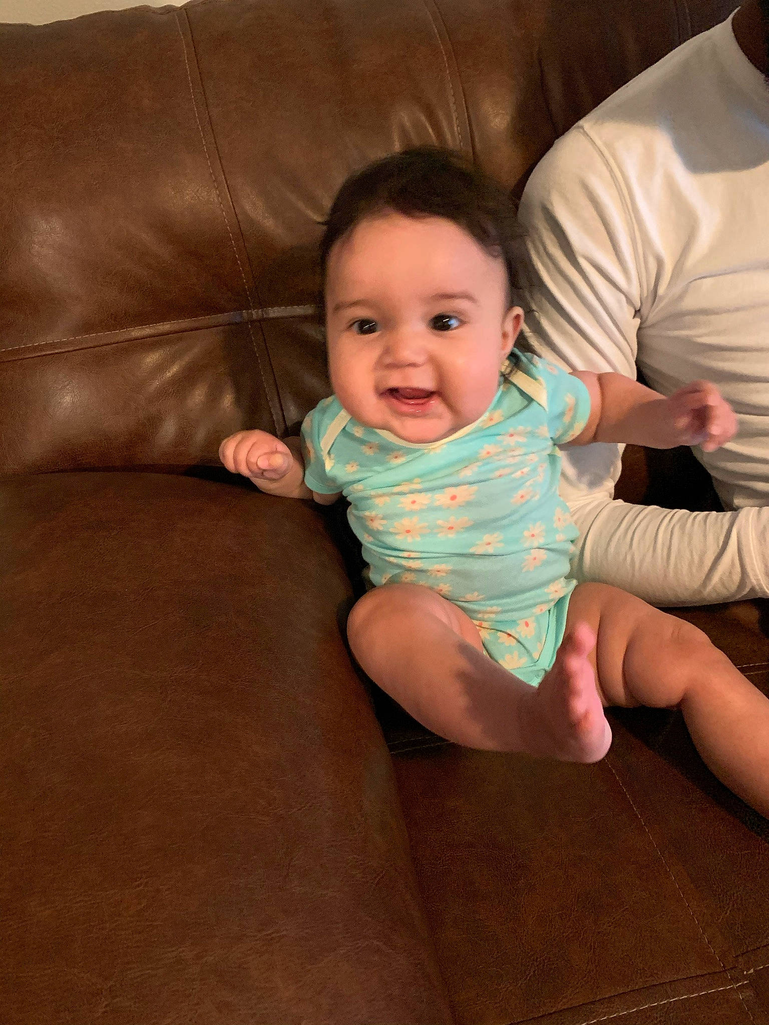 Leanna joined the competition — help win amazing prizes! baby, cheek, child, finger, floor, flooring, fun, head, leg, person, sitting, skin, smile, toddler