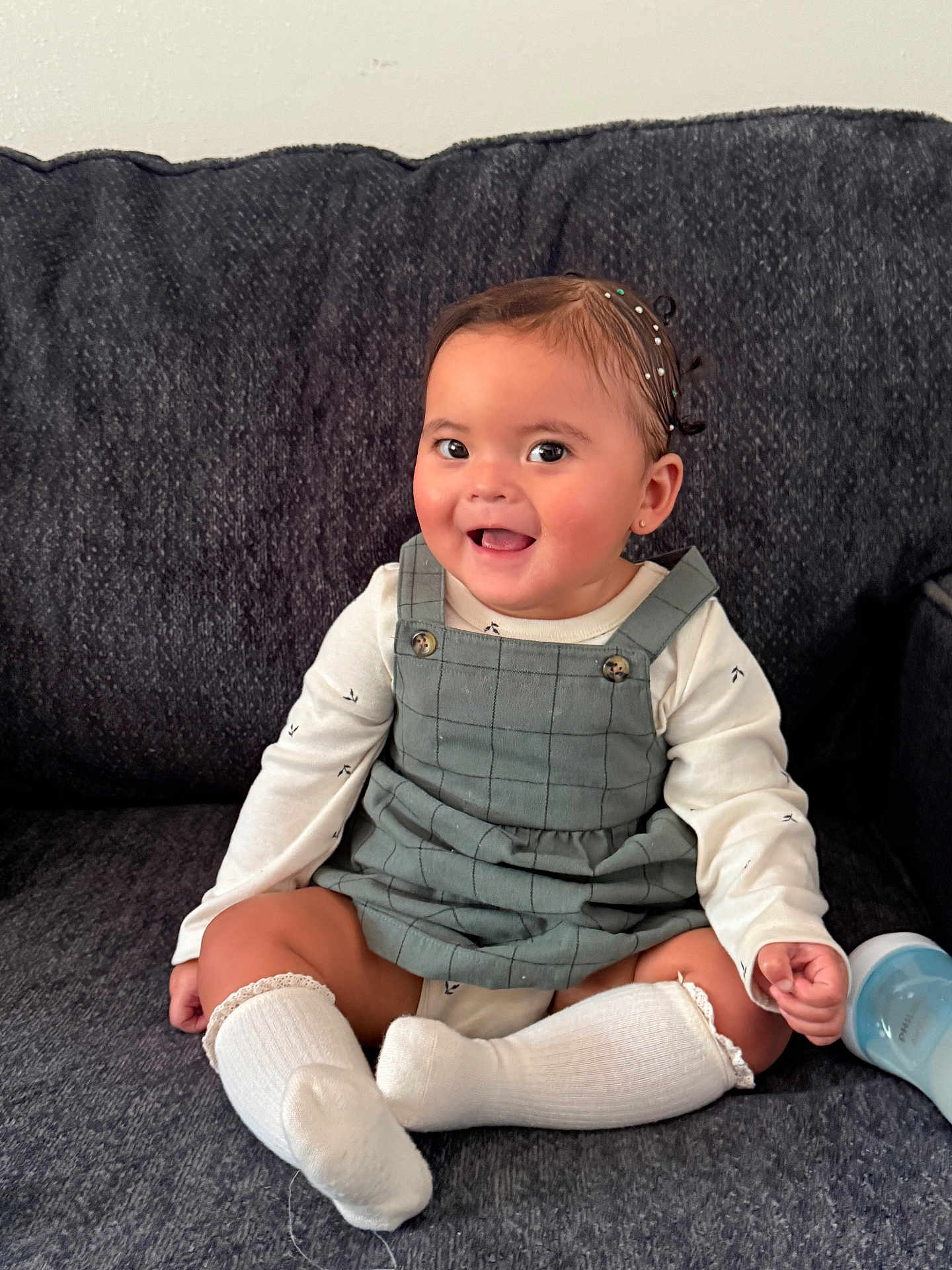 Dulce María Corona joined the competition — help win amazing prizes! baby, child, smiling, sitting, couch, clothing, dress, socks, bottle, happy, indoor, cute, person, face, head, hair, skin, comfort, young, portrait