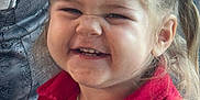 Elyah participe au concours pour gagner de l'argent avec cette photo : button, casual, cheerful, child, closeup, clothing, cute, expression, face, hair, happy, indoor, joyful, person, pigtails, portrait, red_jacket, smiling, toddler, young
