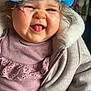 Elyah participe au concours pour gagner de l'argent avec cette photo : baby, blue_hairnet, child, clothing, coat, cute, expression, face, hand, happy, holding, indoor, person, pink_top, portrait, skin, smile, texture, tongue_out, warm_clothing