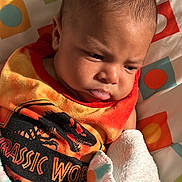 Liam is registered to the contest to win money with this photo: baby, bib, blanket, bodypart, clothing, face, finger, hand, happy, head, homedecor, hosiery, newborn, person, photography, portrait, quilt, smile, sock, towel
