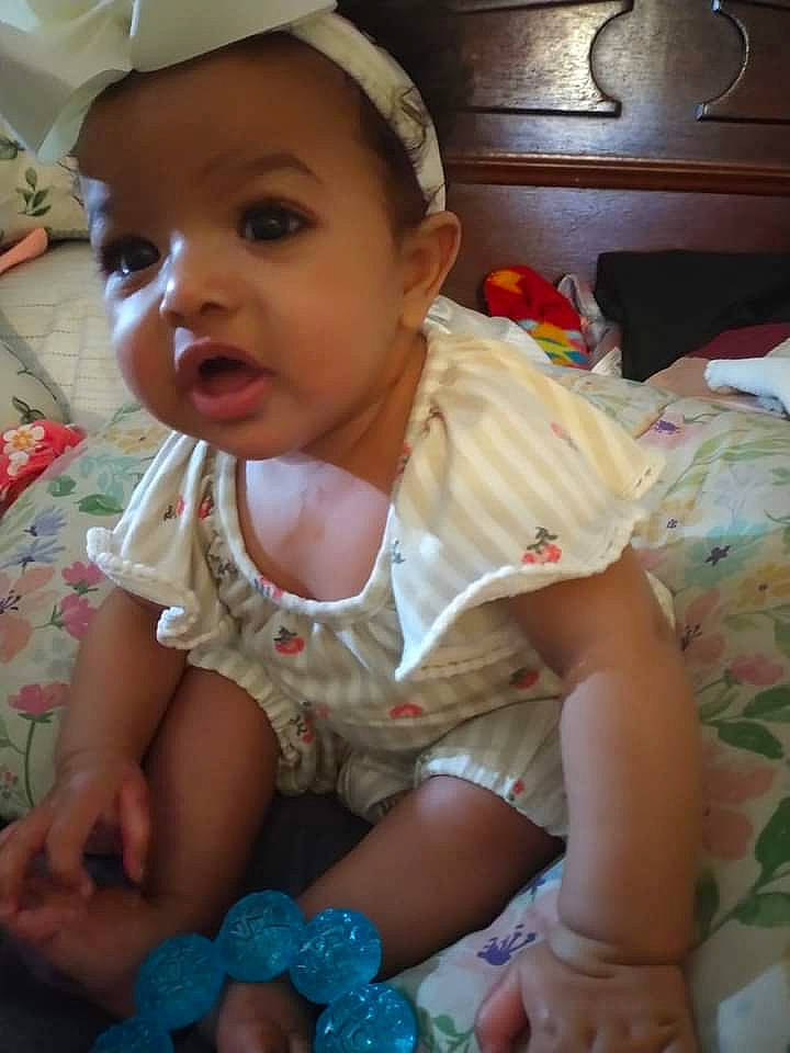 A'Mirahkale is registered to the contest to win money with this photo: baby, baby_toddler_clothing, cap, cheek, child, chin, eye, eyelash, finger, fun, happy, iris, lip, mouth, nose, pattern, person, sitting, skin, thumb