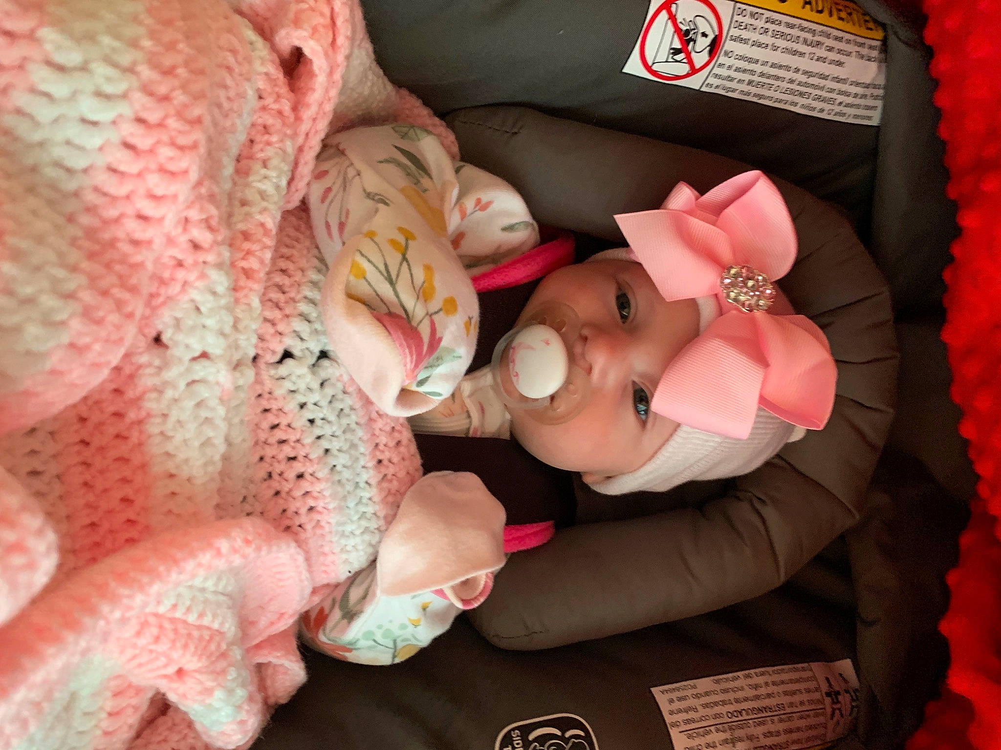 Alexandria is registered to the contest to win money with this photo: baby, baby_products, baby_toddler_clothing, carmine, child, comfort, event, finger, hand, happy, head, headgear, headwear, nail, person, petal, pink, stuffed_toy, textile, toddler