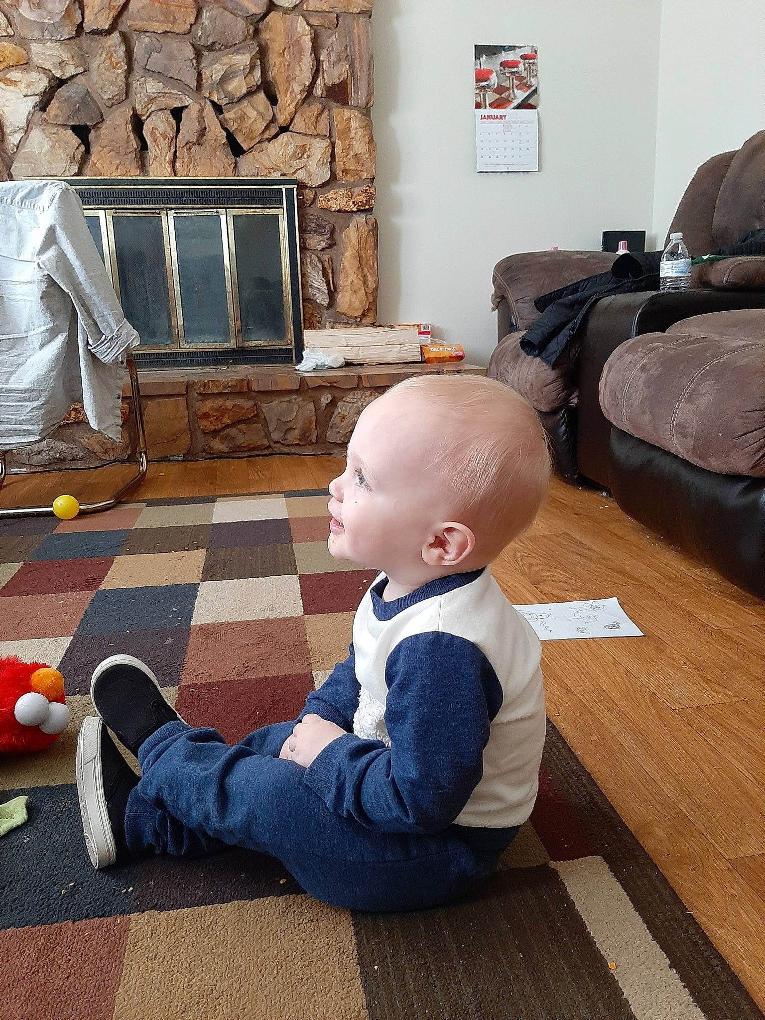 Kelton is registered to the contest to win money with this photo: child, floor, flooring, hardwood, living_room, person, play, room, sitting, toddler, wood, wood_flooring