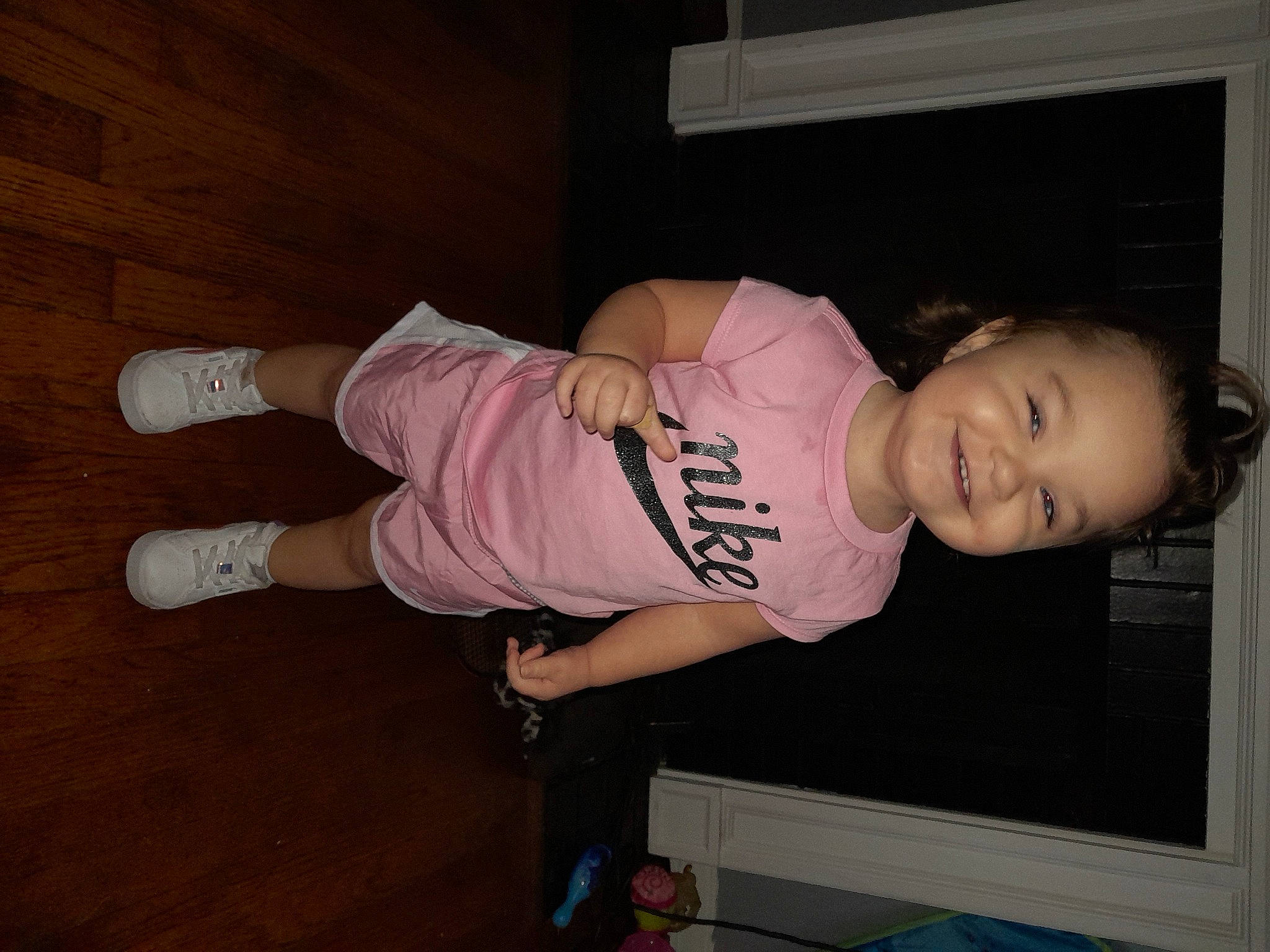 Aryanah is registered to the contest to win money with this photo: baby, baby_toddler_clothing, child, elbow, flash_photography, flooring, fun, hardwood, human_leg, joy, knee, person, room, sleeve, smile, sportswear, sweatpant, t_shirt, thigh, toddler