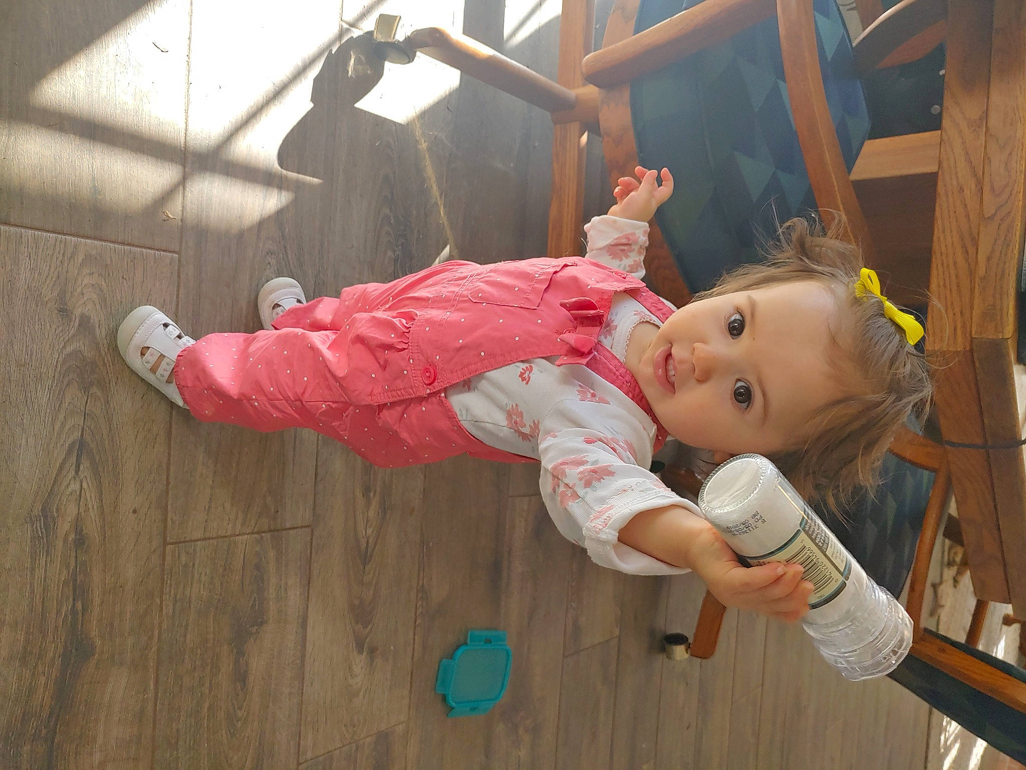 Brittney is registered to the contest to win money with this photo: baby, baby_products, baby_toddler_clothing, baby_toys, child, flooring, fun, happy, hardwood, leisure, person, pink, room, sitting, smile, toddler, toy, wood