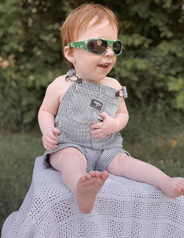 Cameron joined the competition — help win amazing prizes! baby_toddler_clothing, day_dress, dress, eyewear, face, fawn, goggles, grass, hand, lip, pattern, person, pink, plant, sleeve, street_fashion, summer, sunglasses, toddler, vision_care