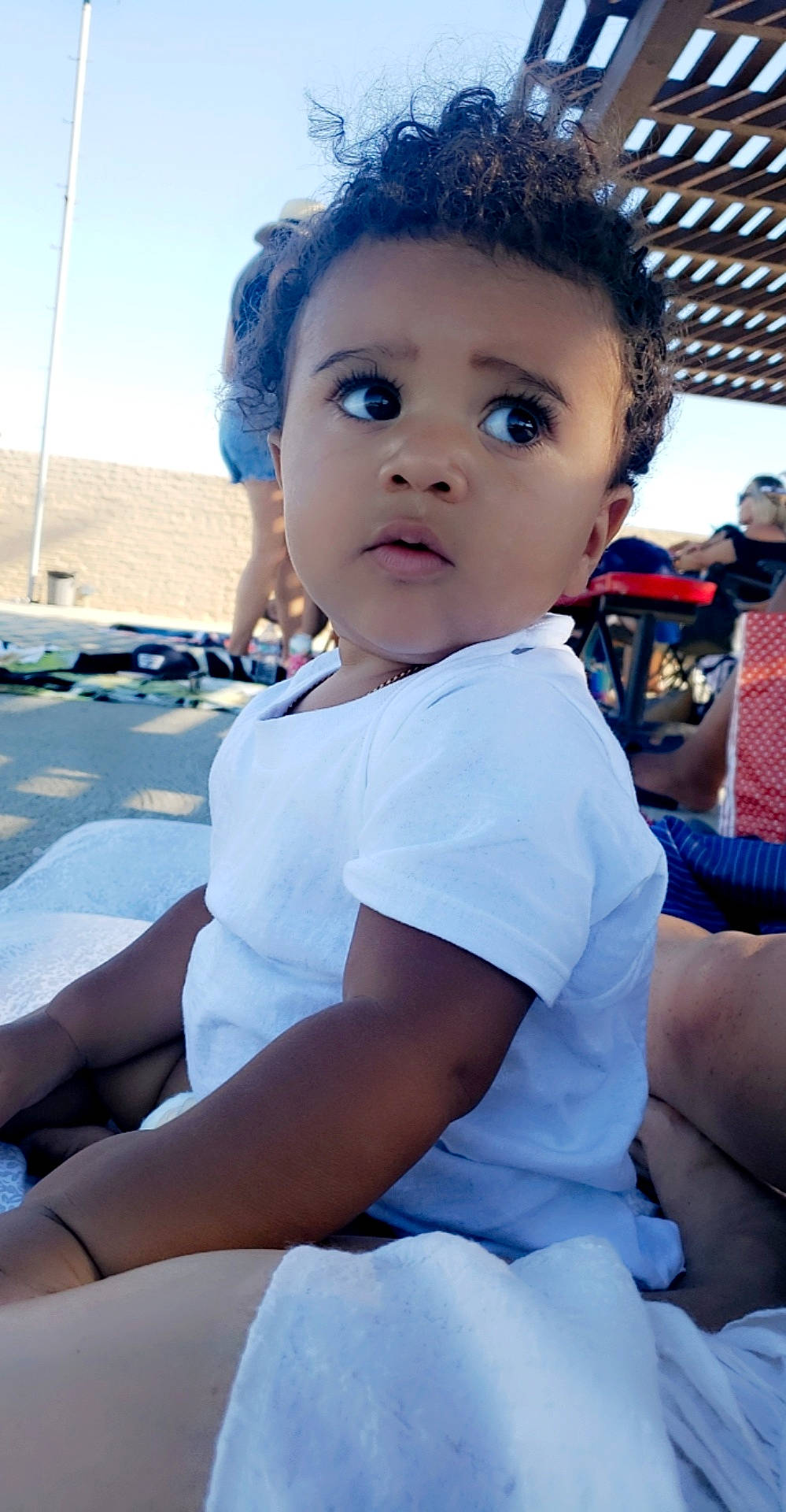 Kody joined the competition — help win amazing prizes! azure, blue, child, electric_blue, eye, face, flash_photography, fun, happy, joint, leisure, ocean, person, recreation, sitting, skin, sky, t_shirt, toddler, travel