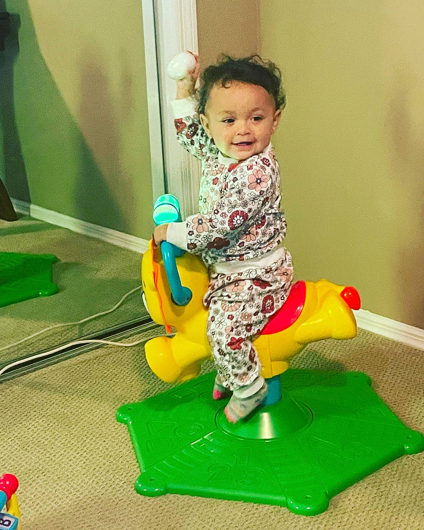 Paisley joined the competition — help win amazing prizes! baby, baby_products, baby_toddler_clothing, baby_toys, child, flooring, fun, grass, green, happy, magenta, person, plastic, play, riding_toy, room, sitting, toddler, toy, toy_vehicle