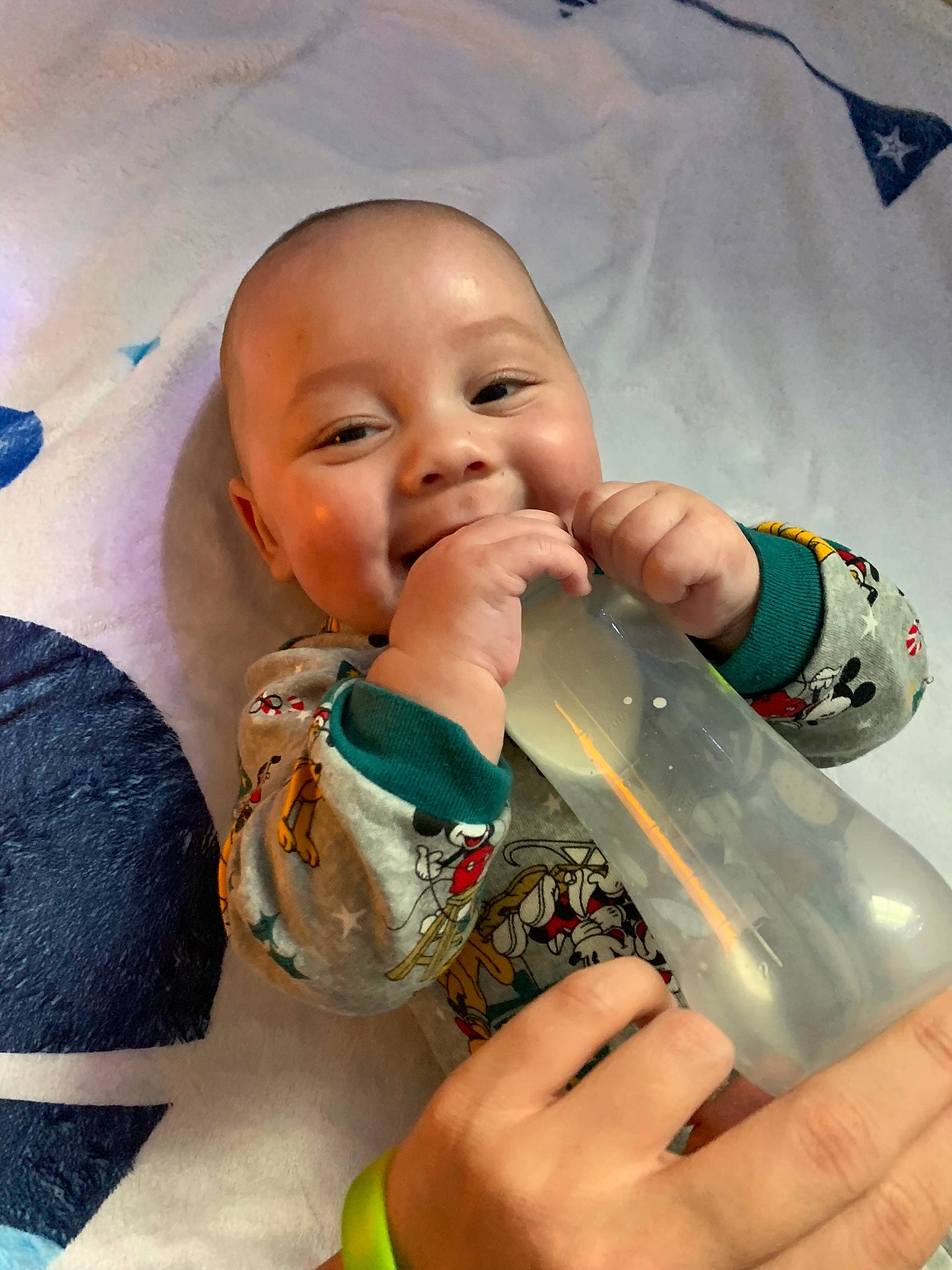 Joell joined the competition — help win amazing prizes! baby_bottle, baby_toddler_clothing, bottle, cheek, drinkware, finger, fluid, green, hand, happy, iris, lip, liquid, mouth, nose, person, plastic_bottle, skin, smile, water