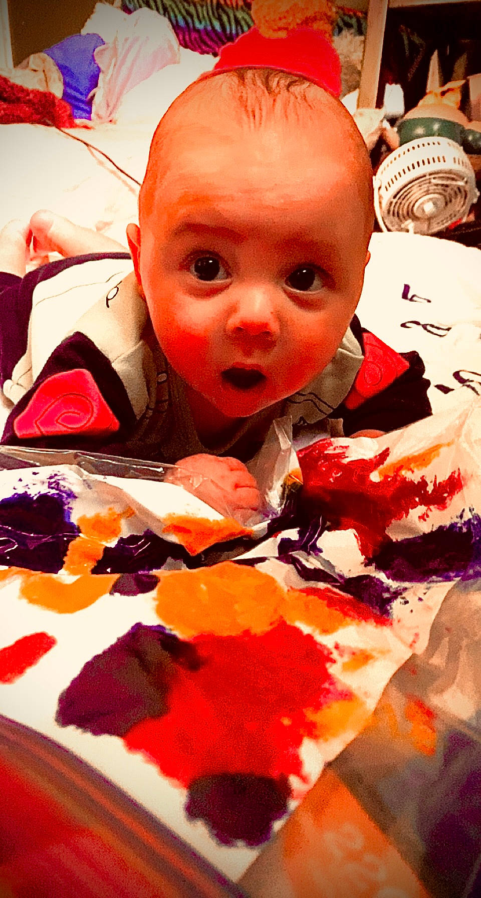 Joell is registered to the contest to win money with this photo: art, baby, baby_products, baby_toddler_clothing, carmine, cheek, child, eyelash, fashion_accessory, fictional_character, fun, happy, lip, mouth, orange, pattern, person, personal_protective_equipment, red, surprise