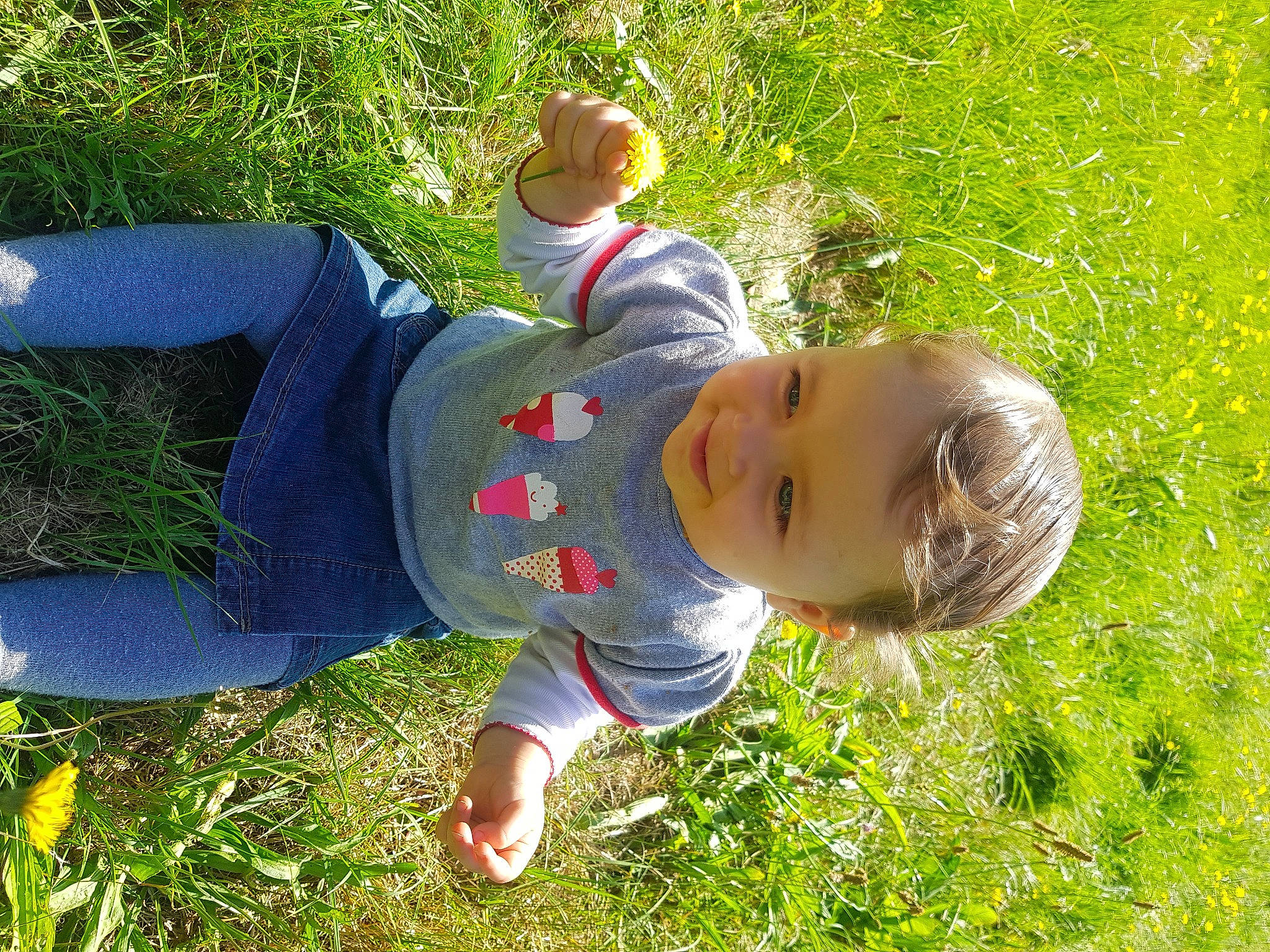 Camille a rejoint le concours — aidez-le/la à gagner de superbes lots ! baby, baby_toddler_clothing, child, denim, fun, garden, grass, grass_family, grassland, groundcover, happy, hat, joy, lawn, leisure, people_in_nature, person, plant, sitting, sneakers
